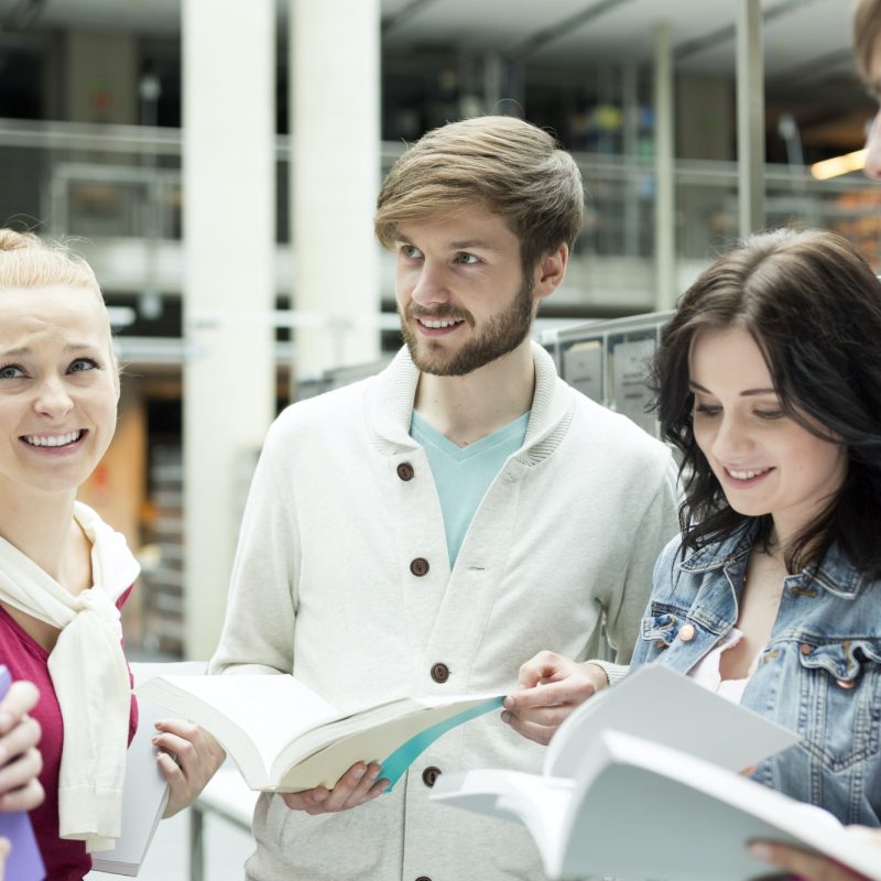 Group of students learning in a university library